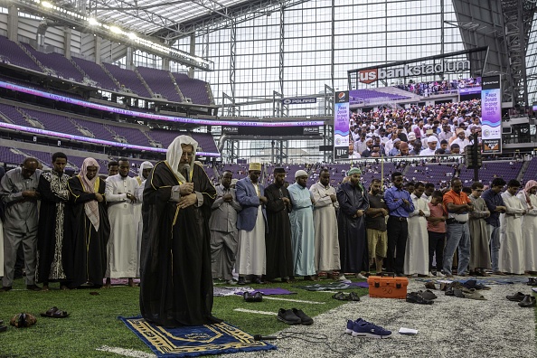 Muslim worshippers pray at the US Bank Stadium during celebrations for Eid al-Adha on August 21, 2018 in Minneapolis, Minnesota. - The US Bank Stadium, home of the National Football League's Minnesota Vikings, is hosting thousands for the event that organizers are calling Super Eid. The holiday, one of the holiest of the year for Muslims, honors the Prophet Ibrahim, also known as Abraham in Judaism and Christianity, and comes at the end of annual hajj pilgrimage. (Photo: KEREM YUCEL/AFP/Getty Images)