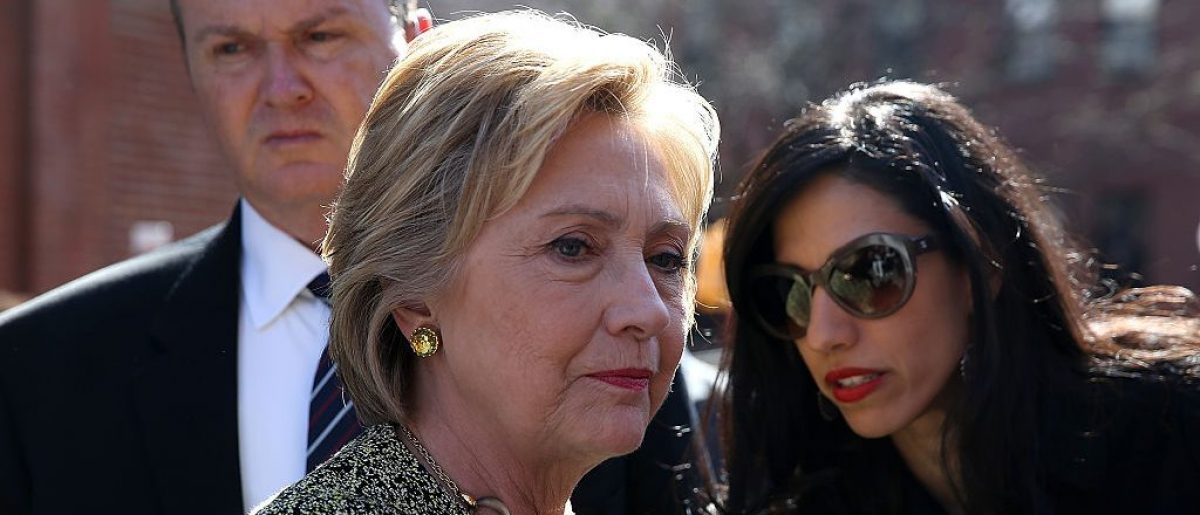 NEW YORK, NY - APRIL 17: Democratic presidential candidate former Secretary of State Hillary Clinton (L) talks with aide Huma Abedin (R) before speaking at a neighborhood block party on April 17, 2016 in the Brooklyn borough of New York City. With two days to go before the New York presidential primary, Hillary Clinton is campaigning in and around New York City. (Photo by Justin Sullivan/Getty Images)