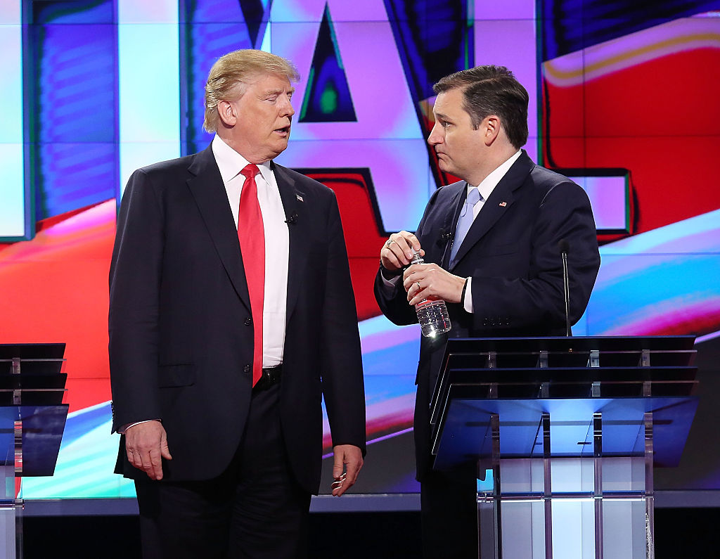 Donald Trump and Ted Cruz talk during a broadcast break in the CNN, Salem Media Group, The Washington Times Republican Presidential Primary Debate (Getty Images)