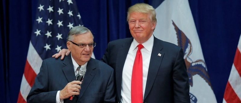 Republican presidential candidate Donald Trump is joined onstage by Maricopa County Sheriff Joe Arpaio (L) at a campaign rally in Marshalltown, Iowa January 26, 2016, after Arpaio endorsed Trump's cacndidacy. REUTERS/Brian Snyder/File Photo