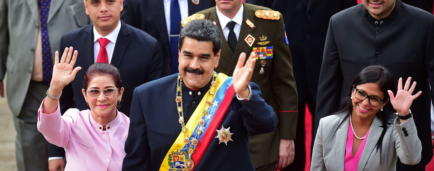 Venezuelan President Nicolas Maduro (C) arrives at the Congress with his wife Cilia Flores (L), the head of the Constituent Assemby, Delcy Rodriguez (R), and other authorities, to address the all-powerful pro-Maduro assembly which has been placed over the National Assembly and tasked with rewriting the constitution, in Caracas on August 10, 2017. Recent demonstrations in Venezuela have stemmed from anger over the installation of the all-powerful Constituent Assembly that many see as a power grab by the unpopular President Maduro. The dire economic situation also has stirred deep bitterness as people struggle with skyrocketing inflation and shortages of food and medicine. PHOTO: Getty Images/AFP/Ronaldo SCHEMIDT