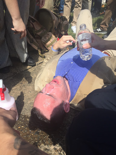 A member of the white supremacist movement is treated for tear gas in Charlottesville. (Henry Rodgers, TheDCNF)
