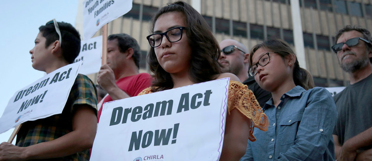Alejandra Garcia (C) stands with supporters of the Deferred Action for Childhood Arrivals (DACA) program during a rally outside the Edward R. Roybal Federal Building in Los Angeles, California, U.S. September 5, 2017. REUTERS/Kyle Grillot