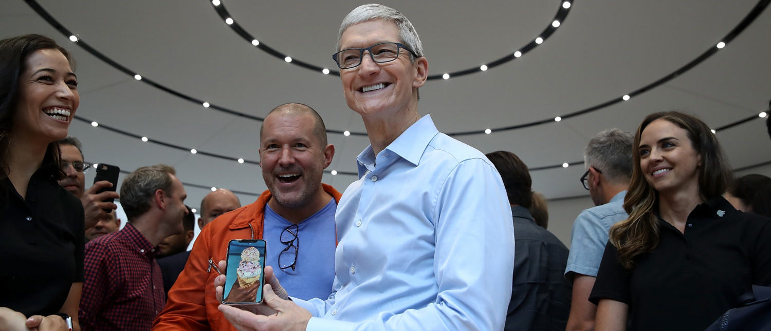 CUPERTINO, CA - SEPTEMBER 12:  Apple CEO Tim Cook (R) and Apple chief design officer Jonathan Ive (L) look at the new Apple iPhone X during an Apple special event at the Steve Jobs Theatre on the Apple Park campus on September 12, 2017 in Cupertino, California. Apple held their first special event at the new Apple Park campus where they announced the new iPhone 8, iPhone X and the Apple Watch Series 3.  (Photo by Justin Sullivan/Getty Images)