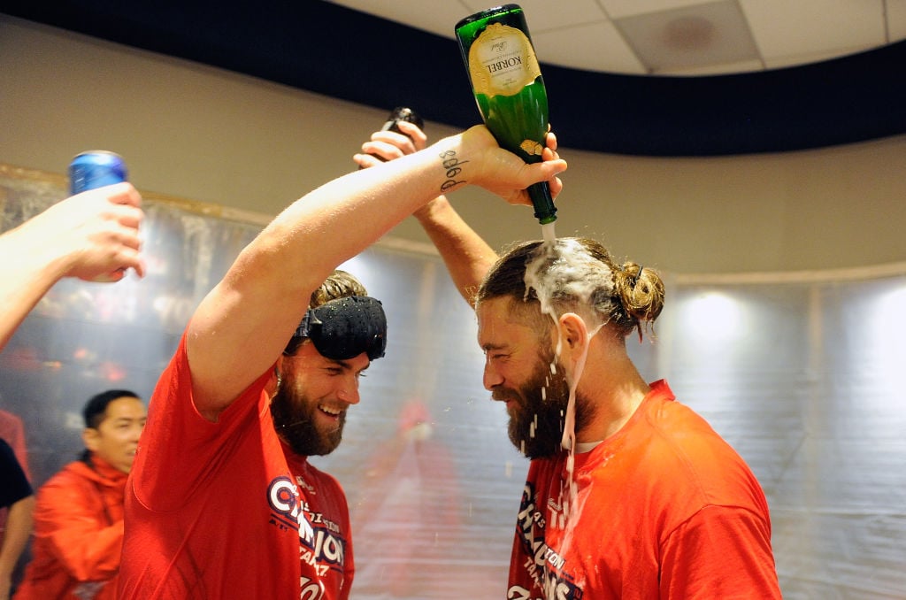 Harper celebrating with Jayson Werth after clinching the National League East against the Philadelphia Phillies at Nationals Park in September 2017. (Photo by Greg Fiume/Getty Images)