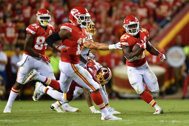 KANSAS CITY, MO - OCTOBER 2: Running back Kareem Hunt #27 of the Kansas City Chiefs rushes through a hole behind the block of Chris Conley during the third quarter of the game against the Washington Redskins at Arrowhead Stadium on October 2, 2017 in Kansas City, Missouri. (Photo by Peter Aiken/Getty Images)