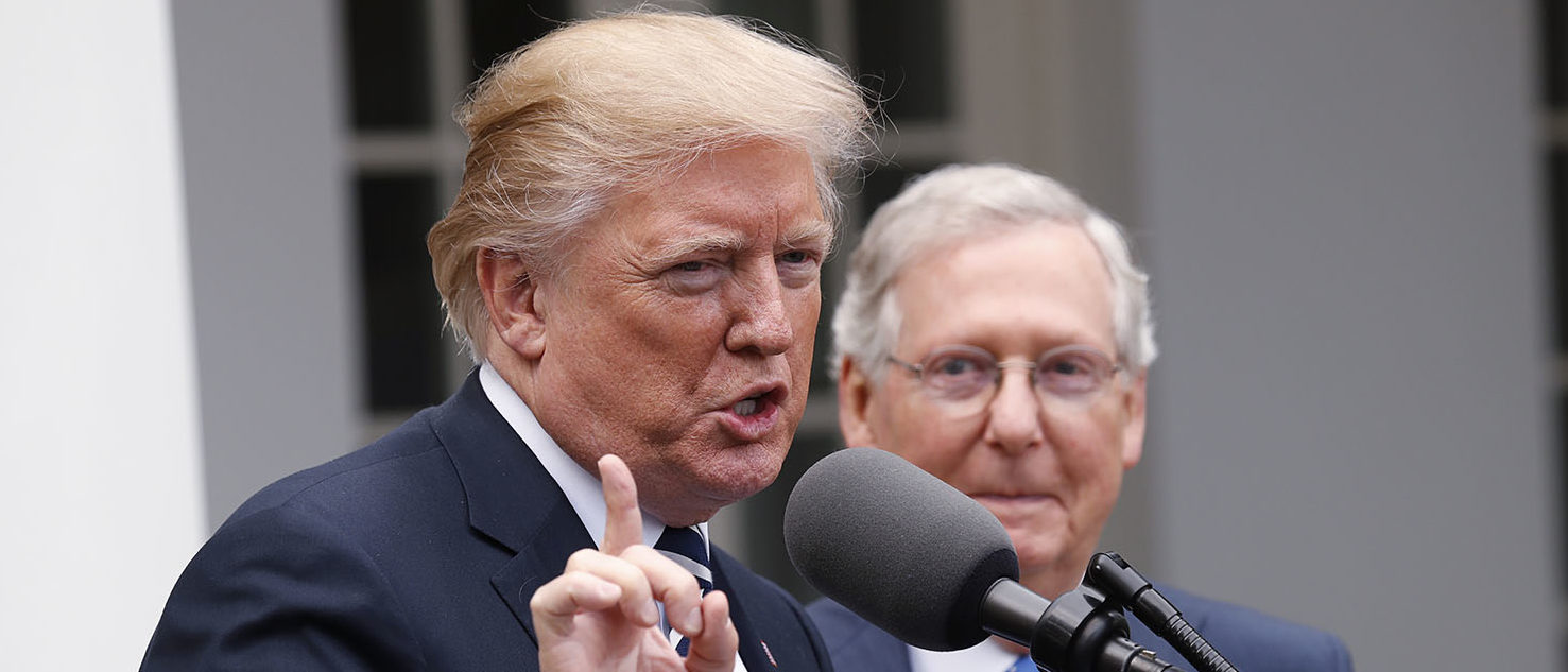 U.S. President Donald Trump speaks to the media with U.S. Senate Majority Leader Mitch McConnell at his side in the Rose Garden of the White House in Washington, U.S., October 16, 2017. REUTERS/Kevin Lamarque