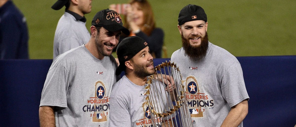 LOS ANGELES, CA - NOVEMBER 01: (L-R) Justin Verlander #35, Jose Altuve #27, and Dallas Keuchel #60 of the Houston Astros hold the Commissioner's Trophy after defeating the Los Angeles Dodgers 5-1 in game seven to win the 2017 World Series at Dodger Stadium on November 1, 2017 in Los Angeles, California. (Photo by Kevork Djansezian/Getty Images)