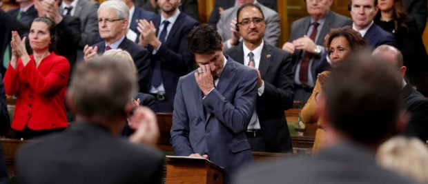 Canada's Prime Minister Justin Trudeau wipes away tears while delivering an apology to members of the LGBT community who were discriminated against by federal legislation and policies, in the House of Commons on Parliament Hill in Ottawa, Ontario, Canada, November 28, 2017. REUTERS/Chris Wattie