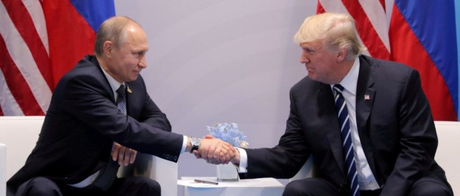 FILE PHOTO: U.S. President Donald Trump shakes hands with Russia's President Vladimir Putin during their bilateral meeting at the G20 summit in Hamburg, Germany July 7, 2017. REUTERS/Carlos Barria/File Photo | Trump Has Putin On Notice