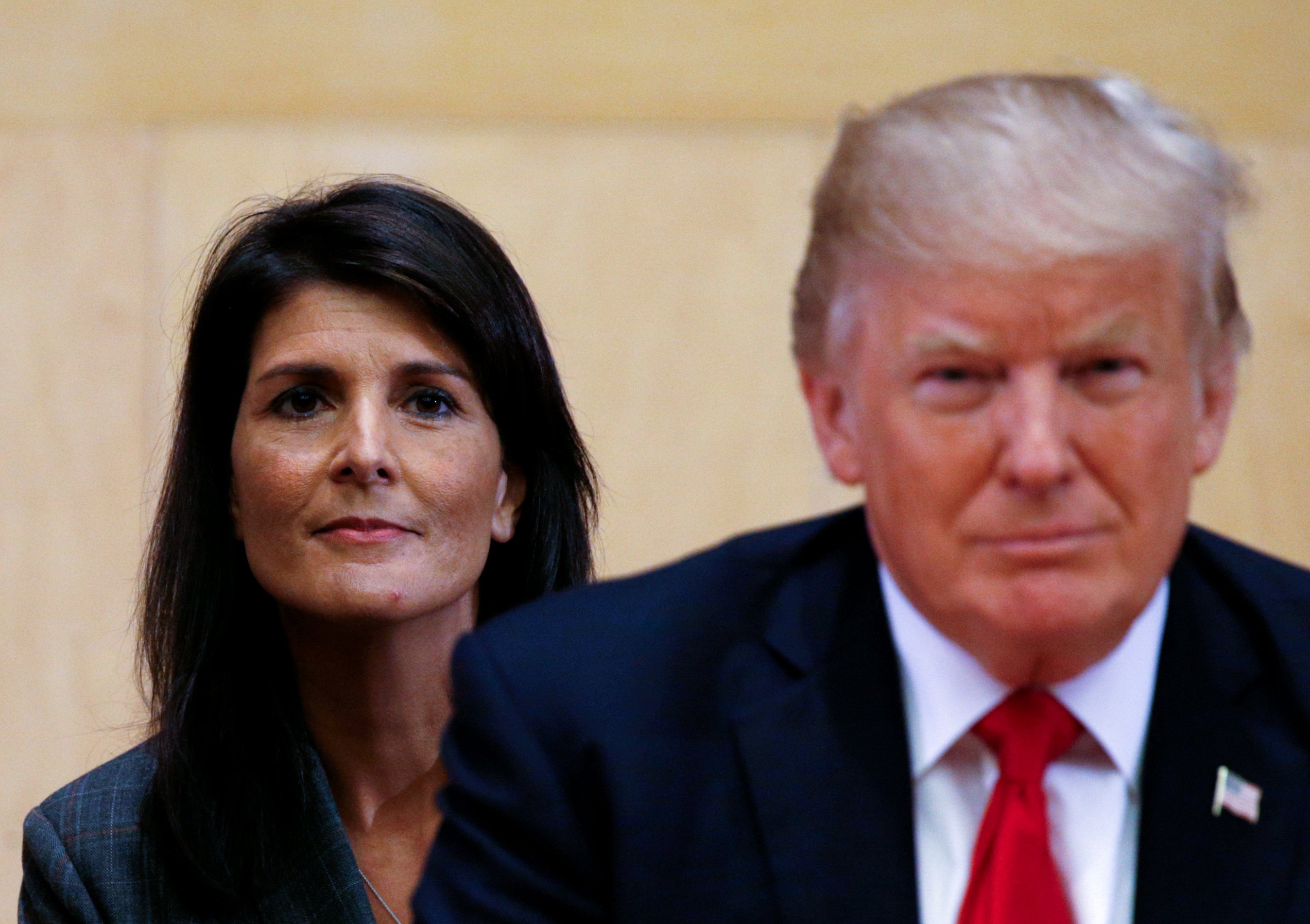 FILE PHOTO: U.S. Ambassador to the UN Nikki Haley (L) and U.S. President Donald Trump participate in a session on reforming the United Nations at UN Headquarters in New York, U.S., Sept.18, 2017. REUTERS/Kevin Lamarque/File Photo 
