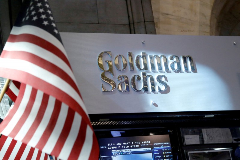 FILE PHOTO: A view of the Goldman Sachs stall on the floor of the New York Stock Exchange in New York, U.S. on July 16, 2013. REUTERS/Brendan McDermid/File Photo