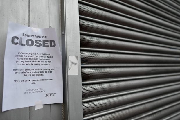 A sign outside a closed KFC fast food store in south London is closed on February 19, 2018 explains the closure is due to a shortage of fresh chicken. US fast food chain KFC said on February 19 it had been forced to close many restaurants in Britain because of a new supplier failing to deliver chicken in time, generating some tongue-in-cheek outrage on Twitter. / AFP PHOTO / BEN STANSALL (Photo credit should read BEN STANSALL/AFP/Getty Images)
