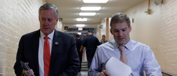 Rep. Mark Meadows (R-NC), left, and Rep. Jim Jordan (R-OH), arrive for a Republican conference meeting at the U.S. Capitol in Washington, U.S., December 20, 2017. REUTERS/Aaron P. Bernstein