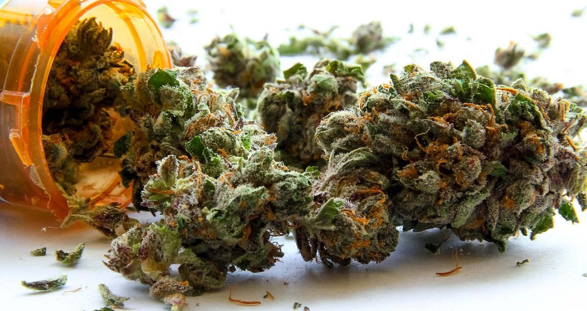 Medical Marijuana D. Medical marijuana pouring out of a prescription bottle against white. (Atomazul/Shutterstock)