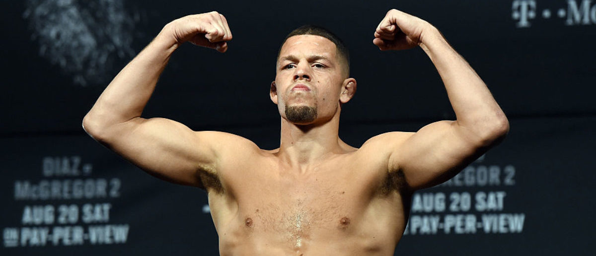 Mixed martial artist Nate Diaz poses on the scale during his weigh-in for UFC 202 at MGM Grand Conference Center on August 19, 2016 in Las Vegas. (Photo by Ethan Miller/Getty Images)