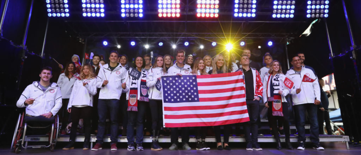 NEW YORK, NY - NOVEMBER 01: Bobsledder Elana Meyers Taylor, snowboarder Alex Deibold, skier Lindsey Vonn, skier Gus Kenworthy, figure skater Ashley Wagner and Team USA pose for a portrait during the 100 Days Out 2018 PyeongChang Winter Olympics Celebration - Team USA in Times Square on November 1, 2017 in New York City. (Photo by Abbie Parr/Getty Images)