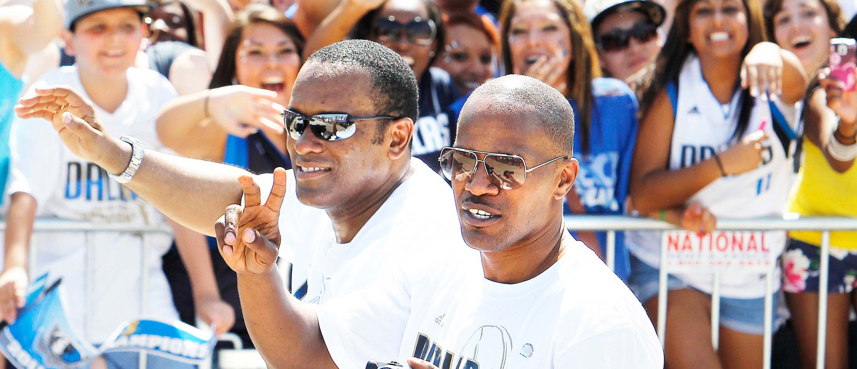CEO of the Dallas Mavericks Terdema Ussery, left, and actor Jamie Foxx, right, during the Dallas Mavericks Victory Parade on June 16, 2011 in Dallas, Texas. (Photo by Brandon Wade/Getty Images)