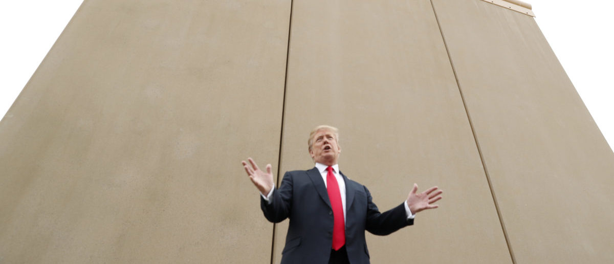 U.S. President Donald Trump speaks while participating in a tour of U.S.-Mexico border wall prototypes near the Otay Mesa Port of Entry in San Diego, California. U.S., March 13, 2018. REUTERS/Kevin Lamarque 