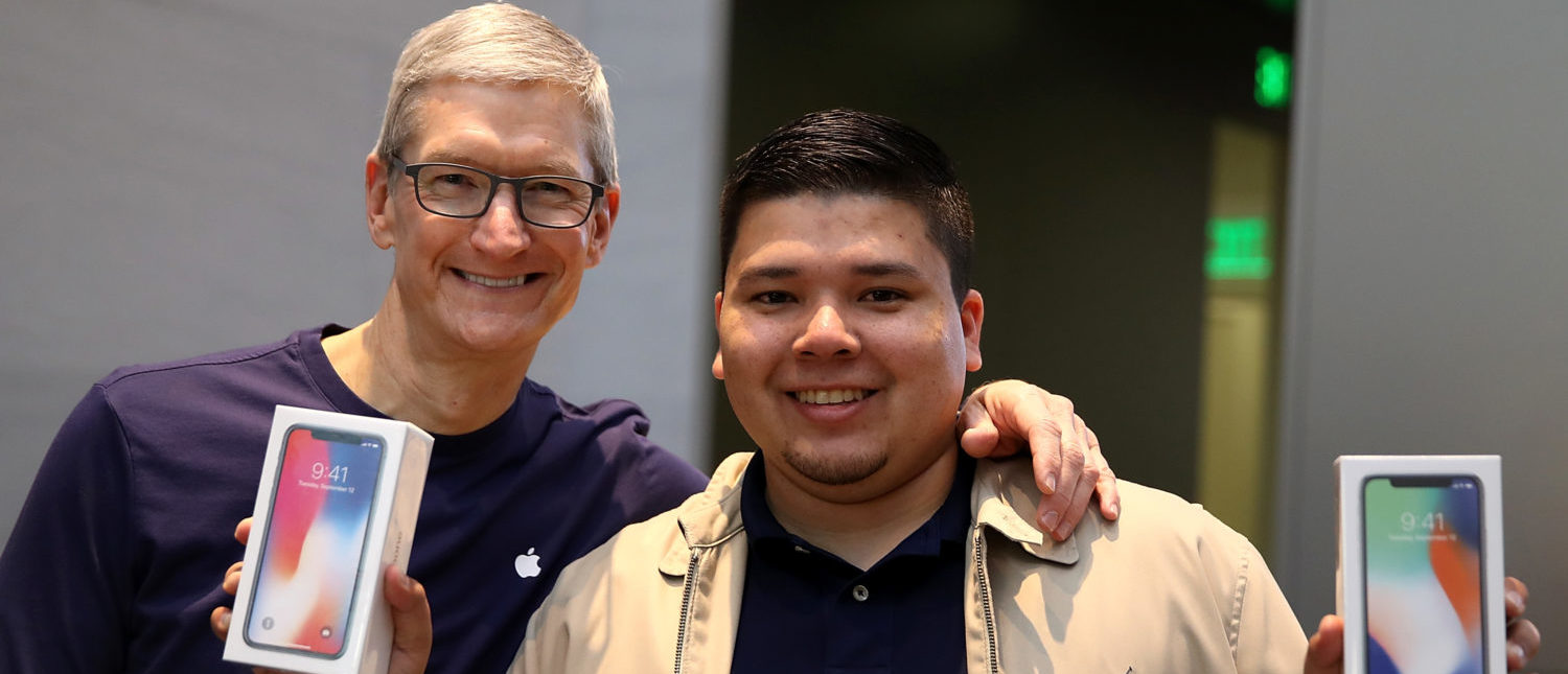 PALO ALTO, CA - NOVEMBER 03:  Apple CEO Tim Cook (L) takes a picture with David Casarez (R) who just purchased the new iPhone X at an Apple Store on November 3, 2017 in Palo Alto, California. The highly anticipated iPhone X went on sale around the world today.  (Photo by Justin Sullivan/Getty Images)
