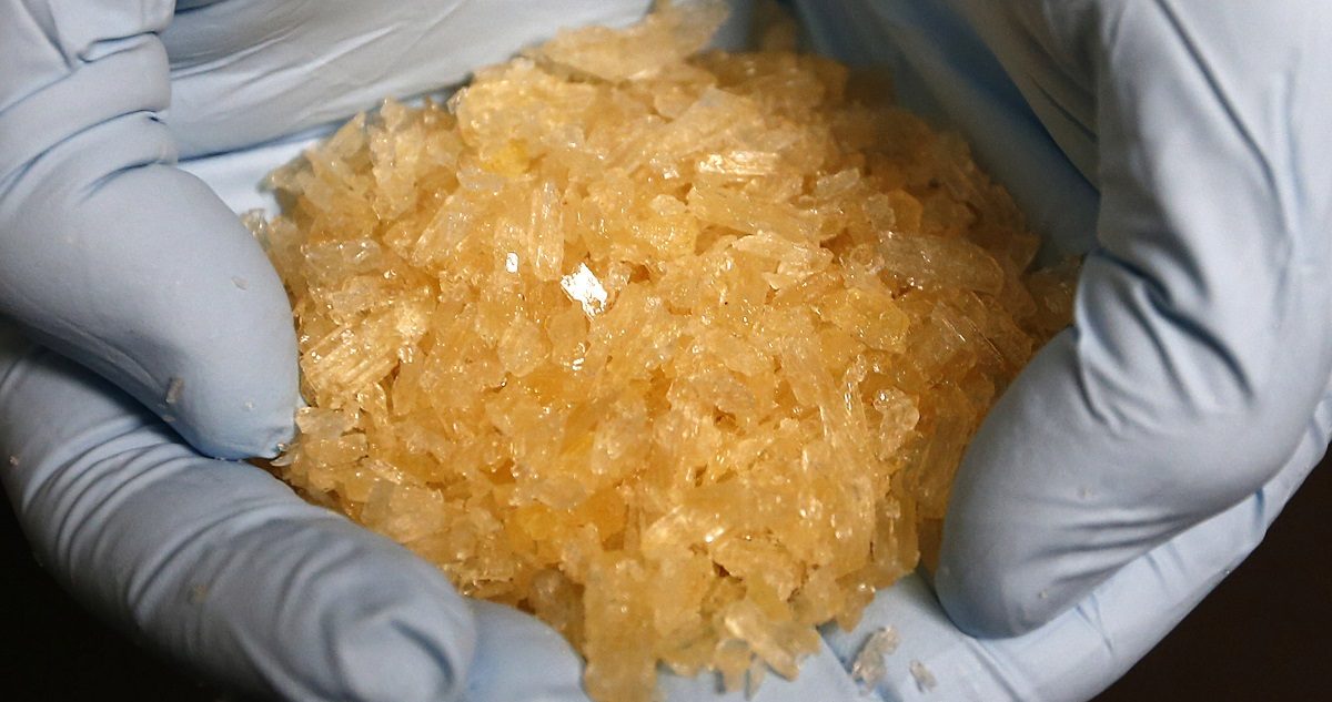 A member of the German Criminal Investigation Division (BKA) displays Crystal Methamphetamine (Crystal Meth) during a news conference at the BKA office in Wiesbaden November 13, 2014. Police found 4 kilograms of Crystal Meth and 2.9 tons of Chlorephedrine, a base substance to produce Crystal Meth, during a police raid in Leipzig on November 5 and November 8, 2014. REUTERS/Ralph Orlowski