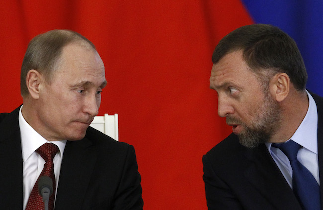 Russia's President Vladimir Putin and Russian tycoon Oleg Deripaska attend a signing ceremony after talks with the Chinese delegation at the Kremlin in Moscow March 22, 2013. REUTERS/Sergei Karpukhin
