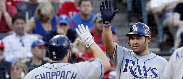 Tampa Bay Rays' Kelly Shoppach (L) is congratulated by teammate Johnny Damon after he hit a two run home run in the fifth inning against the Texas Rangers during Game 1 of their MLB American League Division Series baseball playoffs at Rangers Ballpark in Arlington, Texas, September 30, 2011.  REUTERS/Mike Stone (UNITED STATES - Tags: SPORT BASEBALL) - GM1E7A10K2T01