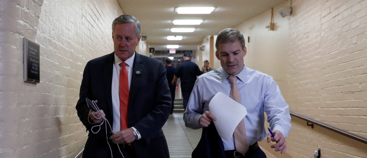 Rep. Mark Meadows (R-NC), left, and Rep. Jim Jordan (R-OH), arrive for a Republican conference meeting at the U.S. Capitol in Washington, U.S., December 20, 2017. REUTERS/Aaron P. Bernstein