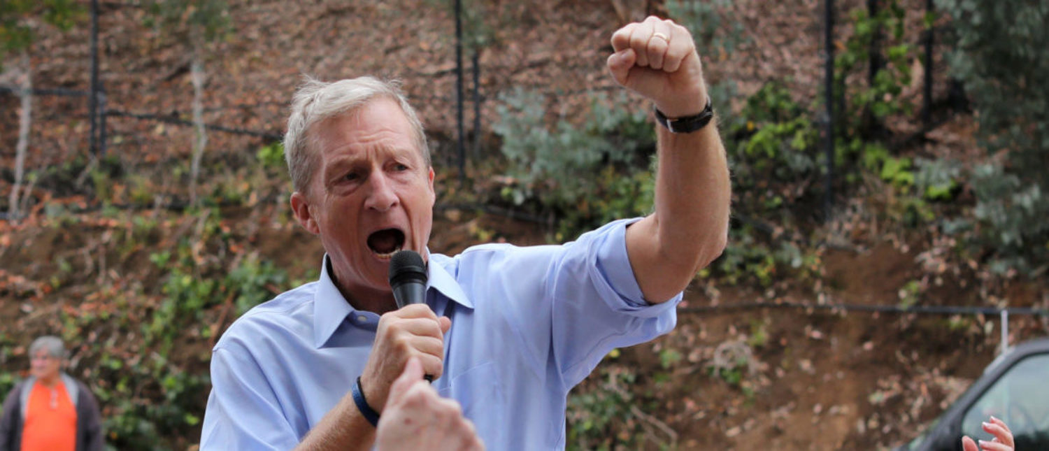 Political and climate activist Tom Steyer speaks while taking part in a protest against U.S. President Donald Trump and Republican congressman Darrell Issa (R-Vista) outside Issa's office in Vista