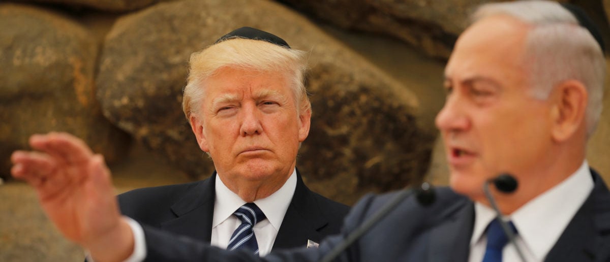 Israel's Prime Minister Benjamin Netanyahu compliments U.S. President Donald Trump on having been the first sitting U.S. president to leave a prayer at the Western Wall, during remarks at the Yad Vashem holocaust memorial in Jerusalem May 23, 2017. REUTERS/Jonathan Ernst