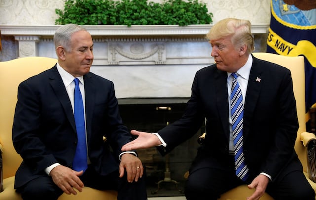 U.S. President Donald Trump meets with Israel Prime Minister Benjamin Netanyahu in the Oval Office of the White House in Washington, U.S., March 5, 2018. REUTERS/Kevin Lamarque