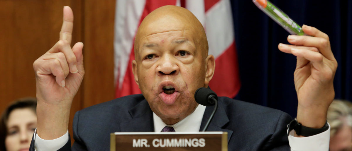 House Oversight and Government Reform Committee ranking member Elijah Cummings (D-MD) holds an EpiPen during the committee hearing on the Rising Price of EpiPens at the Capitol in Washington