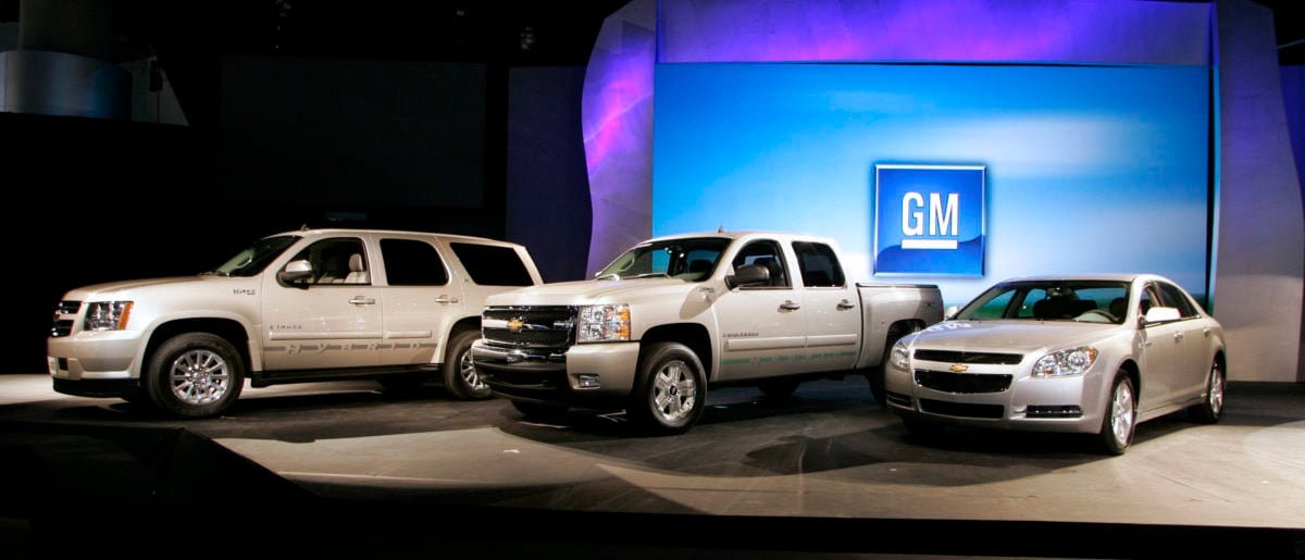 General Motors' Chevrolet hybrid vehicles including the Chevrolet Tahoe Hybrid (L), the Chevy Silverado Hybrid (C), and the Chevy Malibu Hybrid are seen during the Los Angeles Auto Show in Los Angeles, California November 14, 2007. (REUTERS/Danny Moloshok)