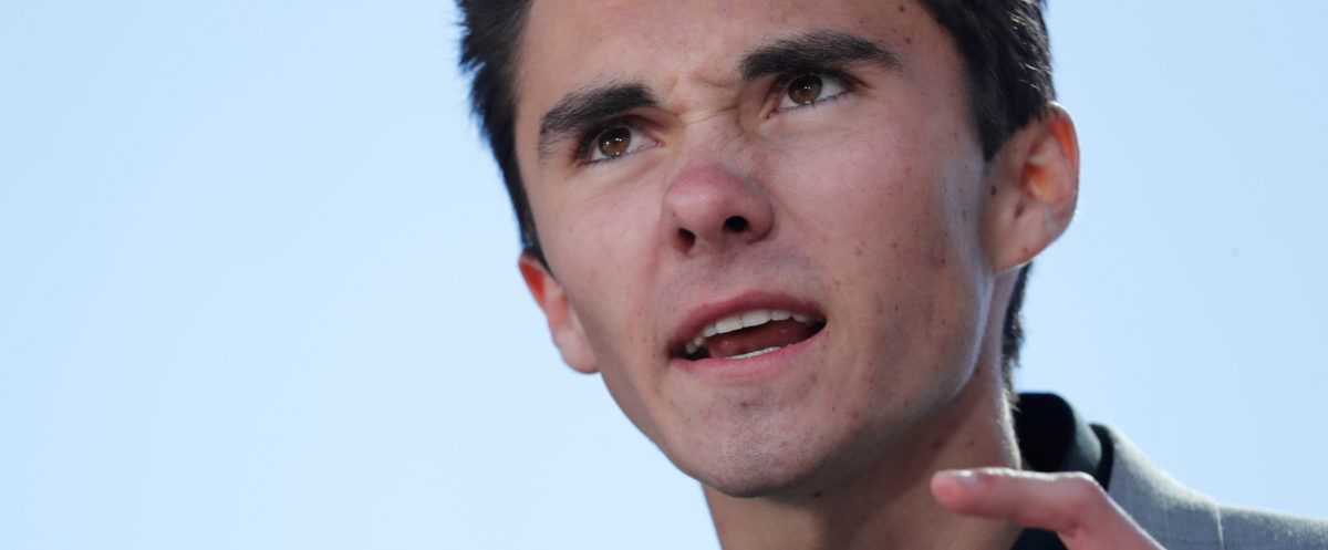 David Hogg, a student at the Marjory Stoneman Douglas High School, site of a February mass shooting which left 17 people dead in Parkland, Florida, speaks as students and gun control advocates hold the "March for Our Lives" event demanding gun control after recent school shootings at a rally in Washington, U.S., March 24, 2018. REUTERS/Jonathan Ernst - HP1EE3O1DB9GE