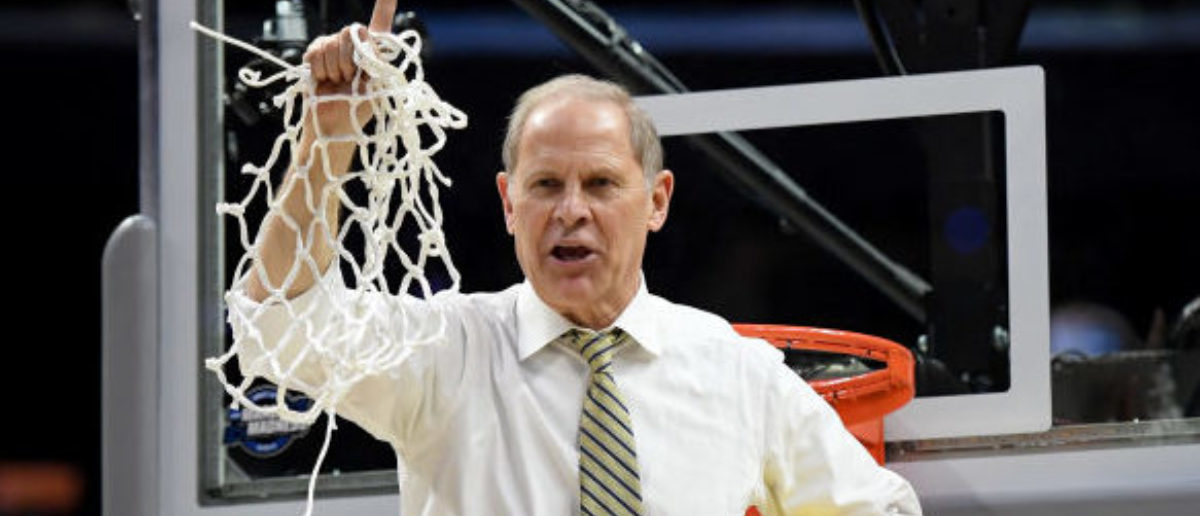 LOS ANGELES, CA - MARCH 24: Head coach John Beilein of the Michigan Wolverines cuts down the net after the Wolverines 58-54 victory against the Florida State Seminoles in the 2018 NCAA Men's Basketball Tournament West Regional Final at Staples Center on March 24, 2018 in Los Angeles, California. (Photo by Harry How/Getty Images)