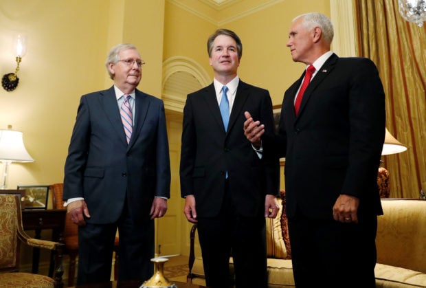 U.S. Senate Majority Leader Mitch McConnell greets Supreme Court nominee Judge Brett Kavanaugh and Vice Preisdent Mike Pence for a meeting in his office at the U.S. Capitol on Capitol Hill in Washington, U.S., July 10, 2018. REUTERS/Leah Millis