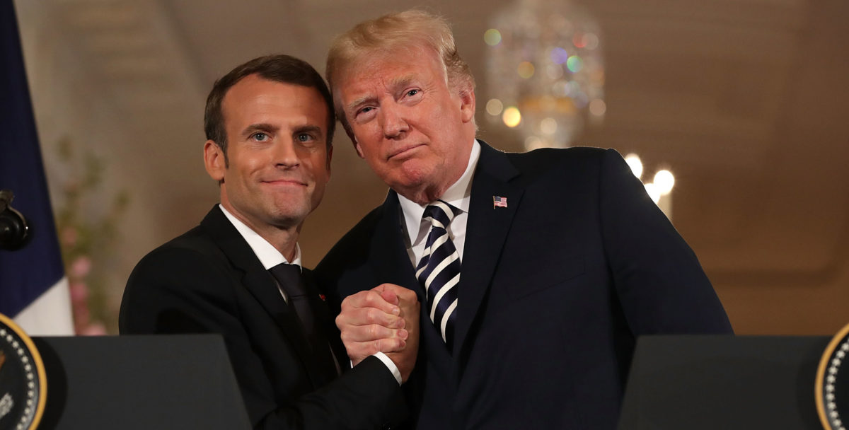 WASHINGTON, DC - APRIL 24: French President Emmanuel Macron (L) and U.S. President Donald Trump embrace at the completion of a joint press conference in the East Room of the White House April 24, 2018 in Washington, DC. Macron and Trump met throughout the day to discuss a range of bilateral issues as Trump holds his first official state visit with the French president. (Photo by Chip Somodevilla/Getty Images)