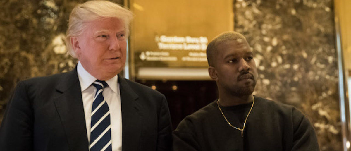 NEW YORK, NY - DECEMBER 13: (L to R) President-elect Donald Trump and Kanye West stand together in the lobby at Trump Tower, December 13, 2016 in New York City. President-elect Donald Trump and his transition team are in the process of filling cabinet and other high level positions for the new administration. (Photo by Drew Angerer/Getty Images)