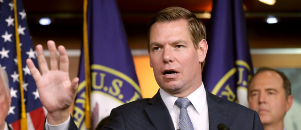 WASHINGTON, DC - JULY 17: House Intelligence Committee member Rep. Eric Swalwell (D-CA) (C) speaks a news conference about the Trump-Putin Helsinki summit in the U.S. Capitol Visitors Center July 17, 2018 in Washington, DC. Past and present members of the committee were very critical of U.S. President Donald Trump's remarks about Russia's work to interfere with the 2016 presidential election. (Photo by Chip Somodevilla/Getty Images)