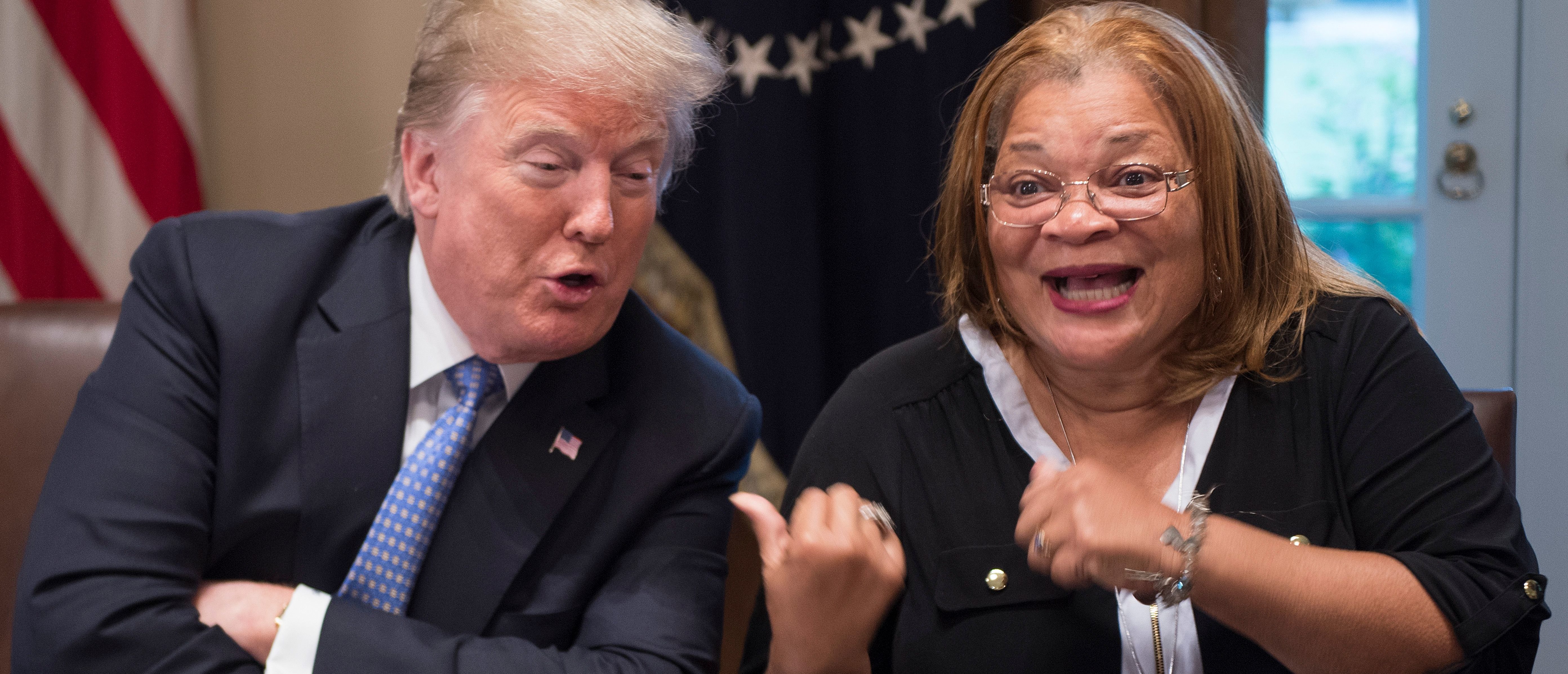 TOPSHOT - US President Donald Trump responds to Dr. Alveda King, niece of Dr. Martin Luther King Jr., during a meeting with inner city pastors at the White House in Washington, DC,on August 1, 2018. - President Trump delivered remarks at the roundtable discussion with several inner city pastors, and discussed the Administrations efforts on prison reform and other policy initiatives to improve Americans in inner cities. (Photo by Jim WATSON / AFP) (Photo credit should read JIM WATSON/AFP/Getty Images)