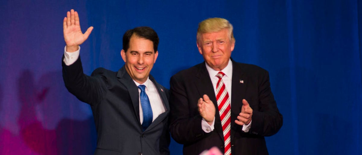 WEST BEND, WI - AUGUST 16: Wisconsin Gov. Scott Walker introduces Republican Presidential Candidate Donald Trump as he gets ready to speak at a rally on August 16, 2016 in West Bend, Wisconsin. (Photo by Darren Hauck/Getty Images)