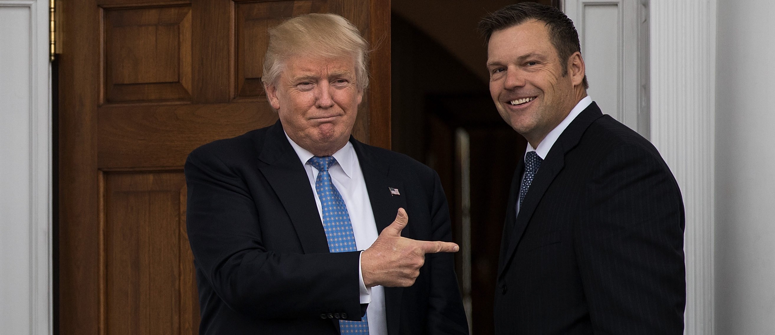 President-elect Donald Trump and Kris Kobach, Kansas secretary of state, pose for a photo following their meeting with president-elect at Trump International Golf Club, November 20, 2016 in Bedminster Township, New Jersey. Drew Angerer/Getty Images