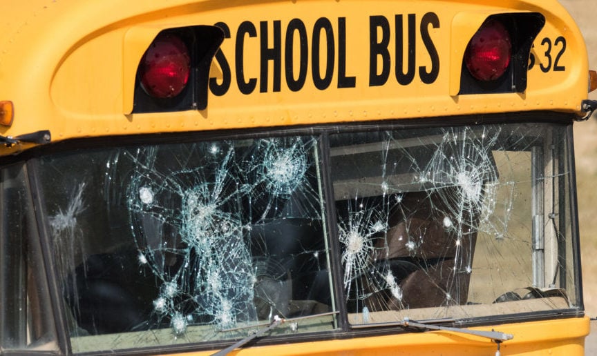 A school bus with bullet holes is pictured. (Shutterstock/Puffin's Pictures)