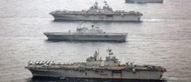 In this handout photo provided by the U.S. Marine Corps, The U.S. Navy amphibious assault ships USS Bonhomme Richard (LHD 6), bottom, and USS Boxer (LHD 4), second from top, are underway with the Republic of Korea Navy Dokdo Amphibious Ready Group March 8, 2016 during Exercise Ssang Yong 2016. Ssang Yong 16 is a biennial combined amphibious exercise conducted by forward-deployed U.S. forces with the Republic of Korea Navy and Marine Corps, Australian Army and Royal New Zealand Army Forces. (Photo by Cpl. Darien J. Bjorndal/U.S. Marine Corps via Getty Images)