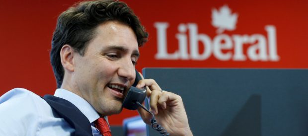 FILE PHOTO: Canada's Prime Minister Justin Trudeau calls Liberal party volunteers to thank them for their help during last year's election at the Liberal party office in Ottawa, Ontario, Canada, October 19, 2016. REUTERS/Chris Wattie/File Photo - RC1E4525E670