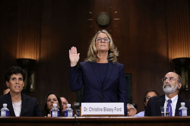 Christine Blasey Ford is sworn in before testifying the Senate Judiciary Committee in the Dirksen Senate Office Building on Capitol Hill September 27, 2018 in Washington, DC. A professor at Palo Alto University and a research psychologist at the Stanford University School of Medicine, Ford has accused Supreme Court nominee Judge Brett Kavanaugh of sexually assaulting her during a party in 1982 when they were high school students in suburban Maryland. (Photo by Win McNamee/Getty Images)