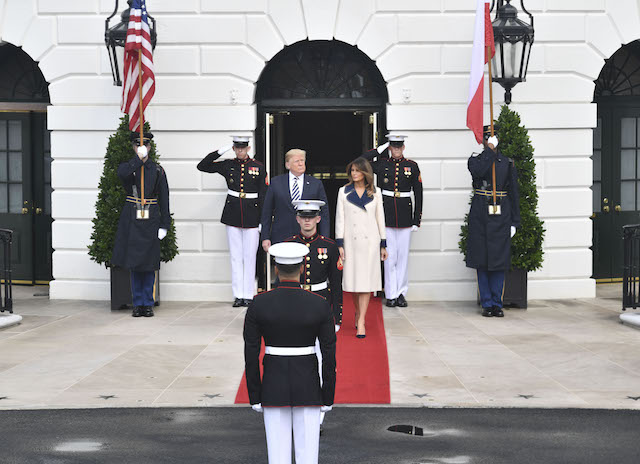 US President Donald Trump and First Lady Melania Trump wait for the arrival of Polish President Andrzej Duda and his wife Agata Kornhauser-Duda to the White House on September 18, 2018 in Washington,DC. (Photo credit: NICHOLAS KAMM/AFP/Getty Images)