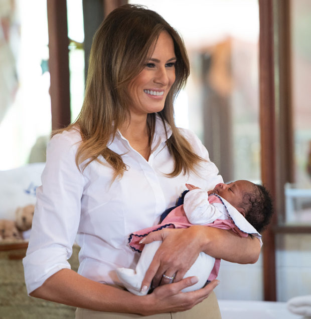 US First Lady Melania Trump holds a baby as she visits the Nest Childrens Home Orphanage in Nairobi, on October 5, 2018, which primarily cares for children whose parents have been incarcerated. (Photo by SAUL LOEB / AFP) (Photo credit should read SAUL LOEB/AFP/Getty Images)