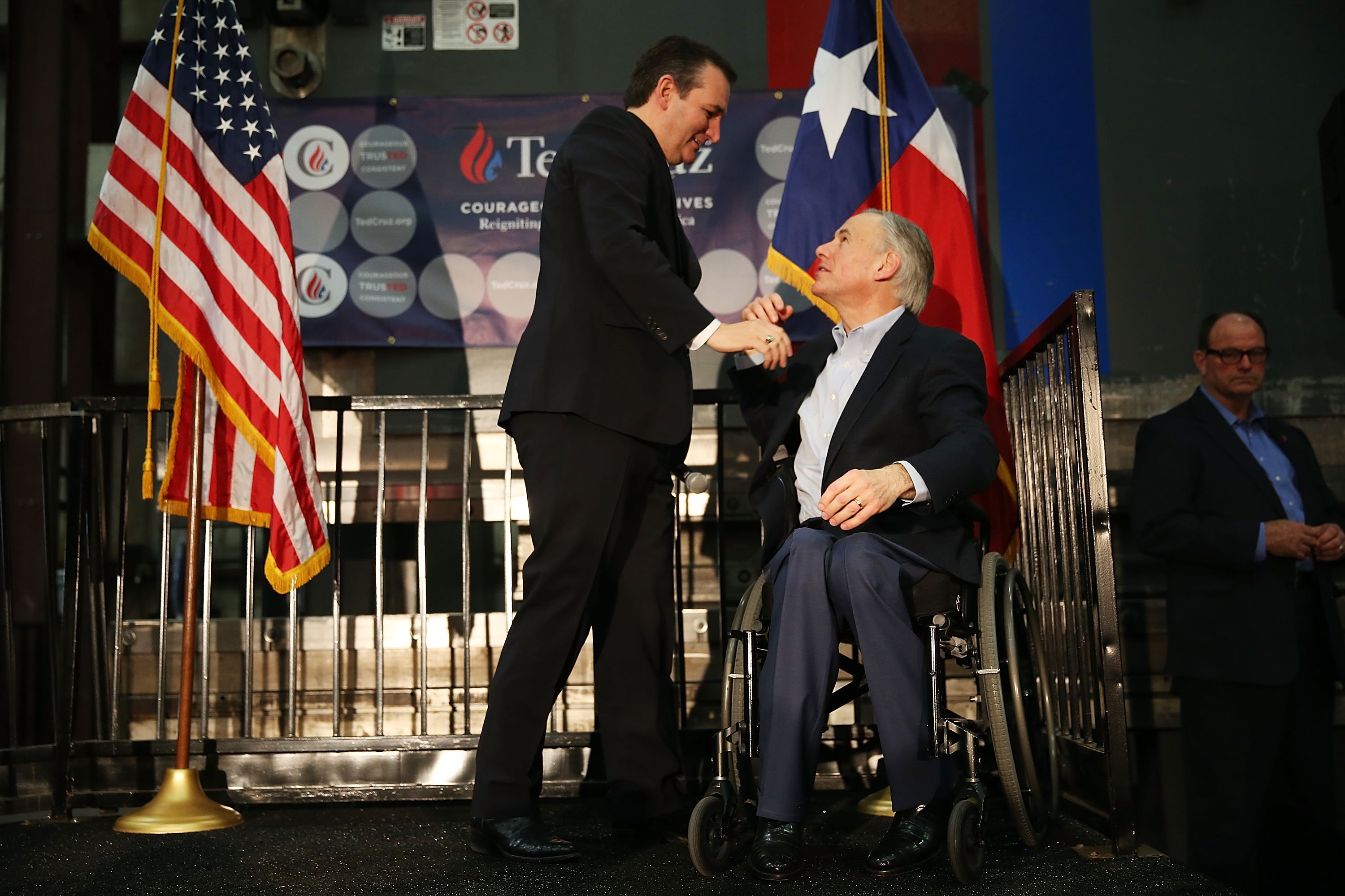 Texas Governor, Greg Abbott, (R) greets Republican presidential candidate U.S. Sen. Ted Cruz (R-TX) during a campaign rally where the Texas governor endorsed him at the Mach Industrial Group on February 24, 2016 in Houston, Texas. The process to select the next Democratic and Republican Presidential candidates continues. (Photo by Joe Raedle/Getty Images)