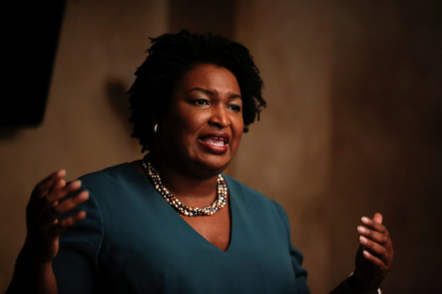 Stacey Abrams speaks at a Young Democrats of Cobb County meeting as she campaigns in Cobb County